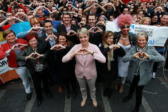 (L-R)Christine Forster, Virginia Edwards, Greens Senator Sarah Hanson-Young, politician Tanya Plibersek (C), Jackie Stricker and Dr Kerryn Phelps make a love heart sign with their hands signalling for marriage equality on May 31, 2015 in Sydney, Australia. Demonstrators are calling on the government to allow for a free vote on marriage equality. (May 30, 2015 - Source: Lisa Maree Williams/Getty Images AsiaPac)