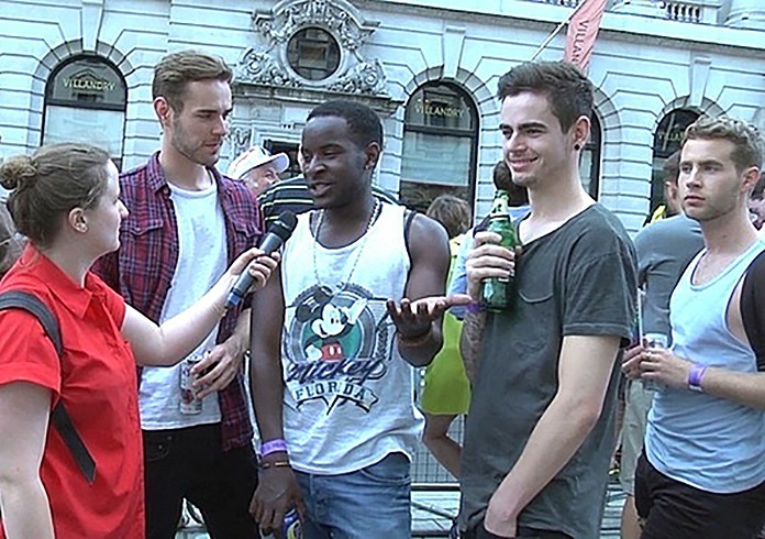 Amy Ashenden speaks to young men at London Pride for her documentary The Gay Word