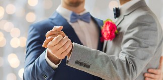 Catholic Archbishop Says Yes To Same-sex Partners At School Formals happy male gay couple holding hands and dancing