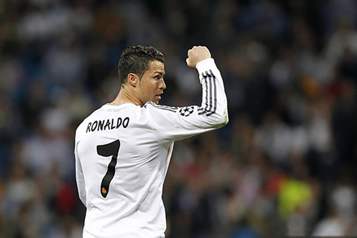 Cristiano Ronaldo showing his strength by raising his right fist after the winning goal against Barcelona.