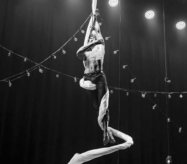 Jack performing as an aerialist as part of his dancing career which he continues with on a part time basis - Supplied