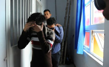 Indonesian Men Guilty of Gay Sex Sentenced to 85 Lashes A police officer escorts two men accused of having gay sex into a holding cell prior to their trial at sharia court in Banda Aceh AP