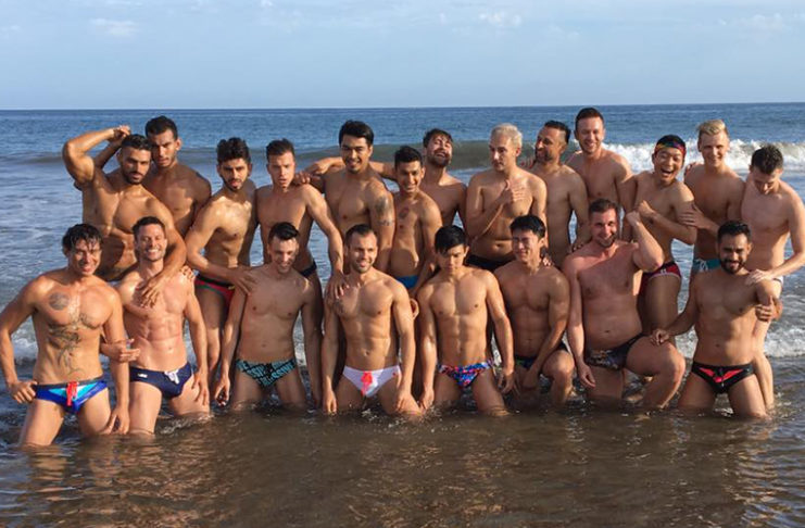 Mr. Gay World Finale is Tonight – Who Will Win? Group photo from the beach photoshoot yesterday of all 21 delegates. (Mr Gay World)