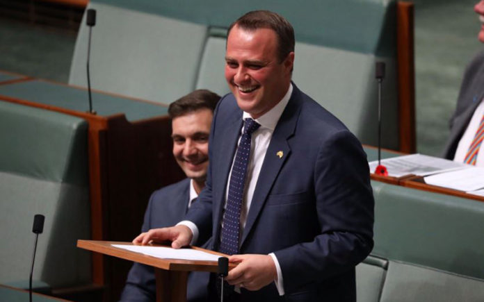 MP Tim Wilson proposes to his partner Ryan on the floor of Federal Parliament today during the same-sex marriage debate (ABC Online)