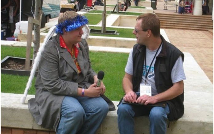 Eighteen-year-old Mike interviewing Carl Greenwood at Out in the Square 2010.