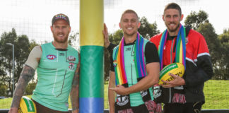 Environment Safe for Gay AFL Footballers to Come-Out According to Pride Match Stars Saints players Tim Membrey, Seb Ross and Tom hickey (L-R) with te custom rainbow goal wraps to be used at the pride match this weekend.(Supplied)