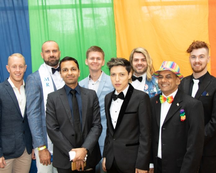 Mr Gay Pride Australia 2019 Finalists at ChillOut Festival Carnival in Daylesford (L-R Rhys Cameron, Rad Mitic, Prashant Bhatia, Liam Davies, Andre Cordova, Justin Hill, Johann De Joodt & Darby Savage) (Photo credit - Fred LeMarche - The Boy Project)