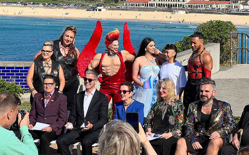 Dignitaries and performers at the 2024 Mardi Gras launch at Bondi Beach.