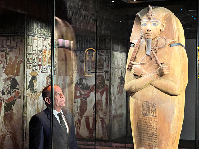 Dr Mostafa Waziry, Secretary-General of the Supreme Council of Antiquities, Ministry of Tourism and Antiquities in Egypt admiring the rare coffin of Ramses II at the new exhibition Ramses & the Gold of the Pharaohs at the Australian Museum in Sydney.