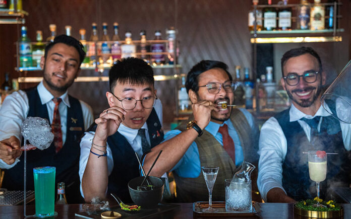 Grain Bar bartenders (l-r) Sanjeev Sharma, Hai Ha Nguyen, Sarath Nair and Marco Rosati with the signature cocktails. (Supplied)