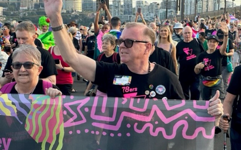 Mr Rebbell Barnes leading the 78ers across the Sydney Harbour Bridge at the World Pride march in 2023. (Supplied)